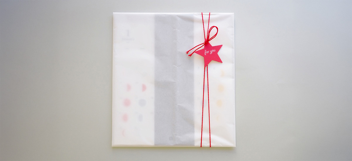 ミチルを包装紙で包んだイメージ